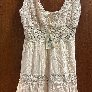 Never worn with tag Easel lace dress in beige color size large